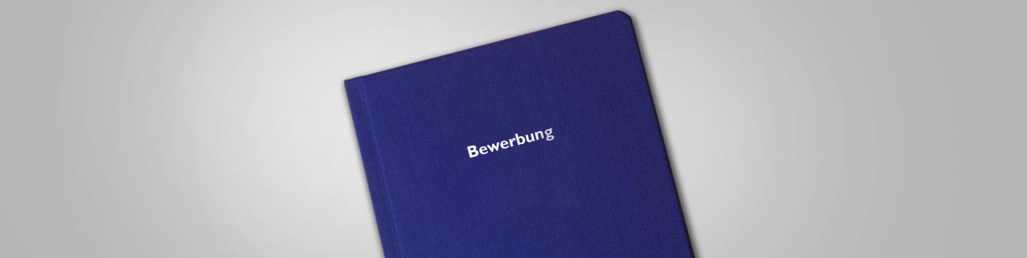 Bewerbungsmappe mit der Aufschrift Bewerbung